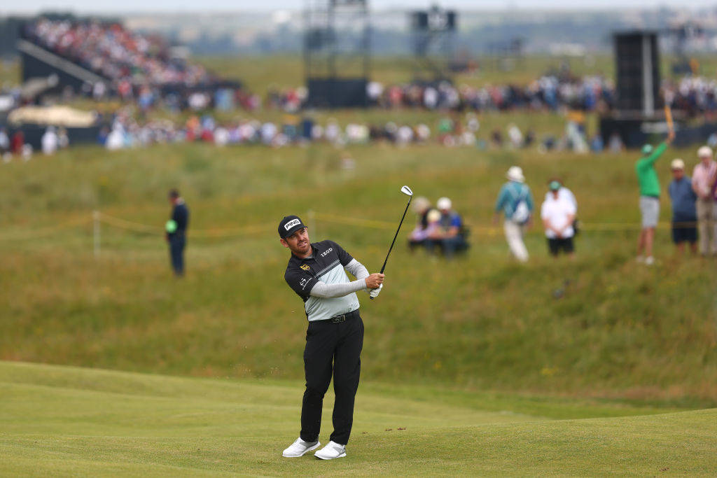 Louis Oosthuizen plays his approach to the 10th hole in round one of The 149th Open